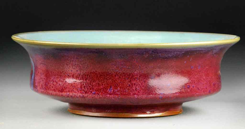 Appraisal: A Chinese Raspberry Glaze Porcelain BasinThe bowl raised on short