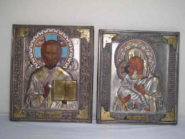 Appraisal: Two Russian painted icons Silver overlay with gold accents Cloisonne