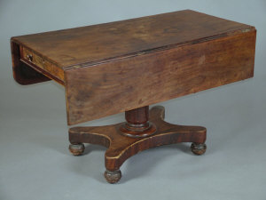 Appraisal: A Victorian mahogany dropleaf pedestal table the top over end