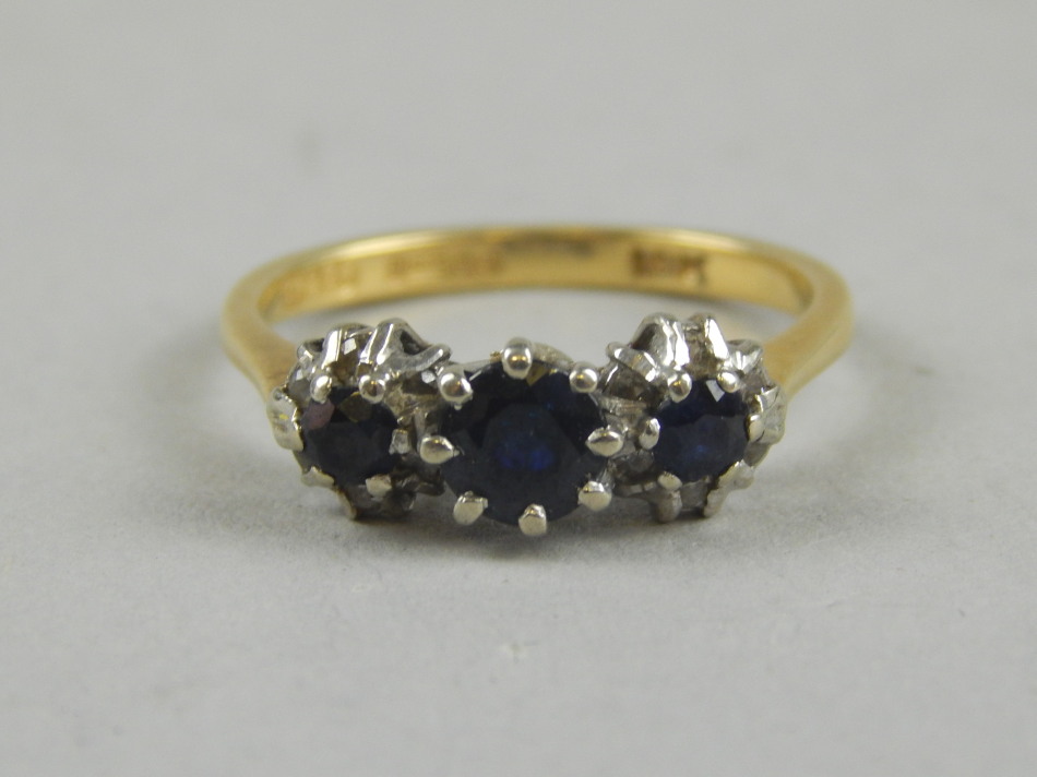 Appraisal: An ct gold sapphire and diamond ring with three dark