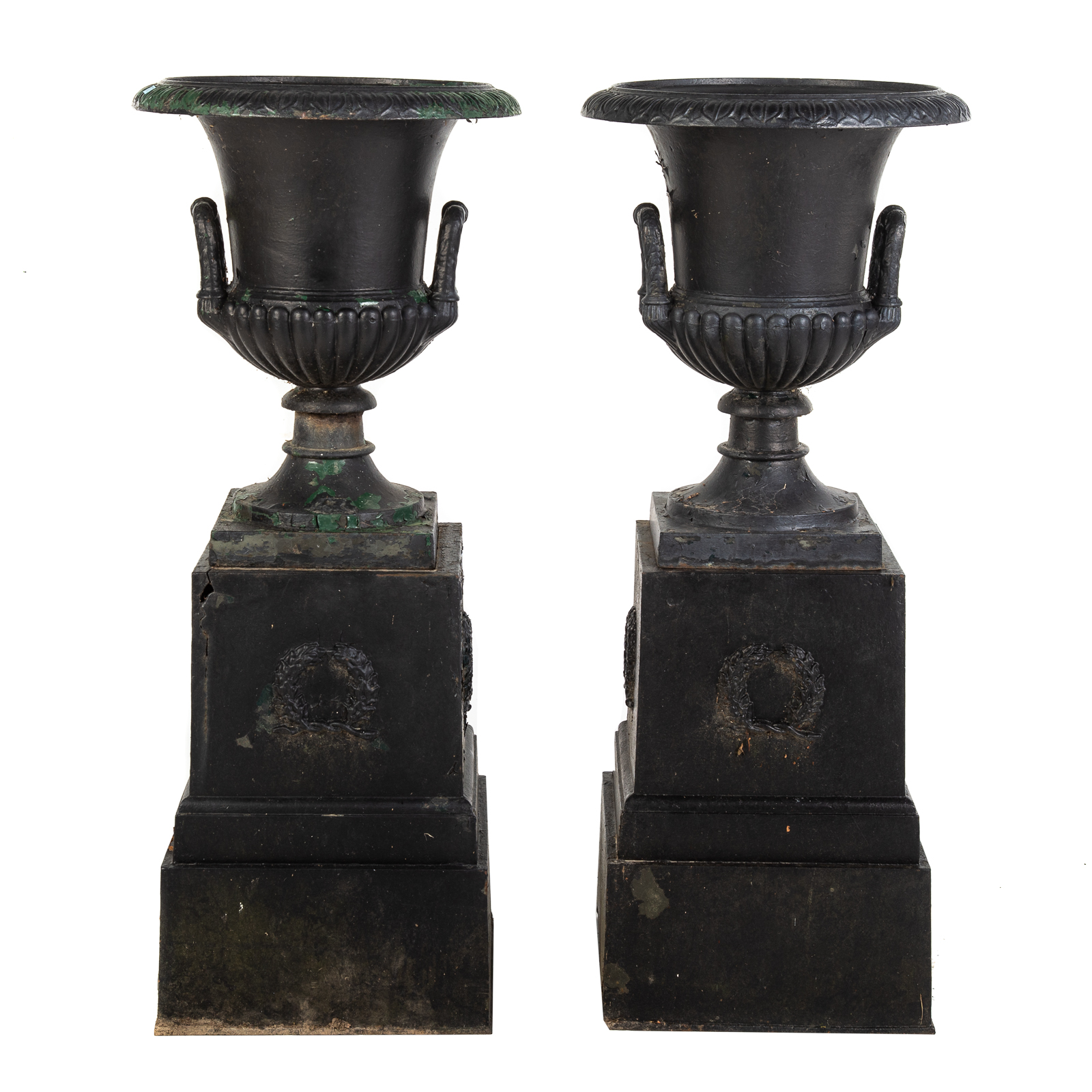 Appraisal: A PAIR OF VICTORIAN CAST IRON URNS BASES Second half-