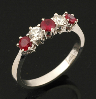 Appraisal: CT WHITE GOLD RUBY AND DIAMOND HALF HOOP RING