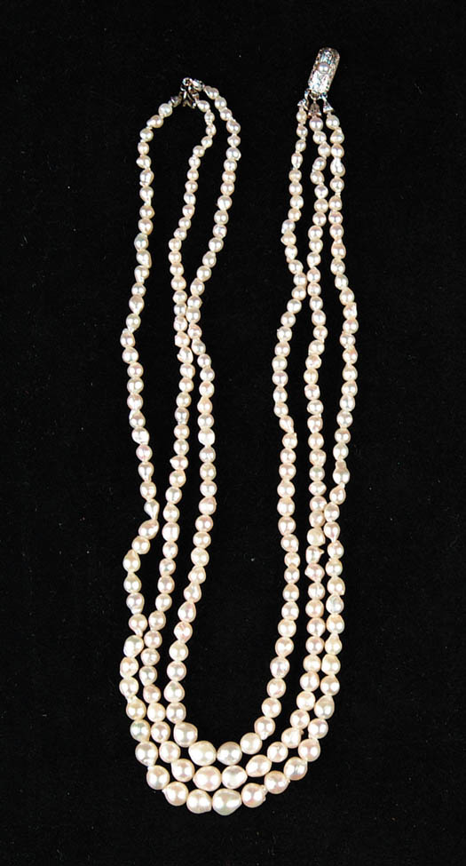 Appraisal: THREE STRAND BAROQUE PEARL NECKLACE Graduated clasp marked SIZE CONDITION