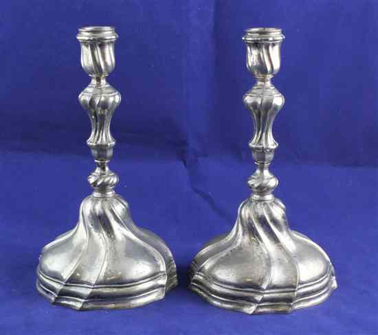 Appraisal: A pair of continental silver candlesticks with turned waisted stems