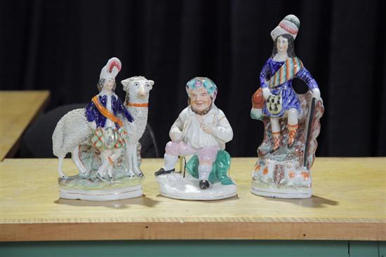 Appraisal: THREE STAFFORDSHIRE FIGURES One with highlander and sheep ''h One