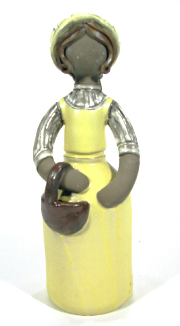 Appraisal: Scaninavian stoneware figurine in a yellow glazed dress painted factory