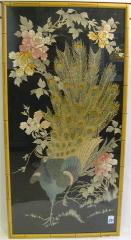 Appraisal: A CHINESE EMBROIDERED PANEL featuring a peacock with tail extended