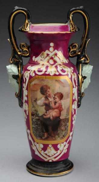 Appraisal: Continental Double Handled Vase Depicts boy feeding a child No