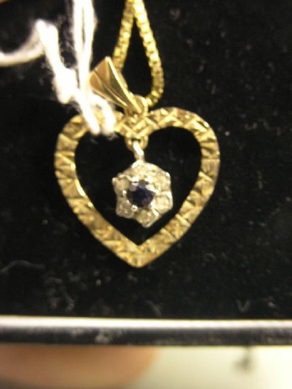 Appraisal: A ct gold pendant heart shape set with diamond points