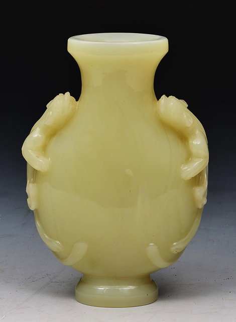 Appraisal: A CHINESE PALE GREEN JADE SMALL VASE with lizard handles