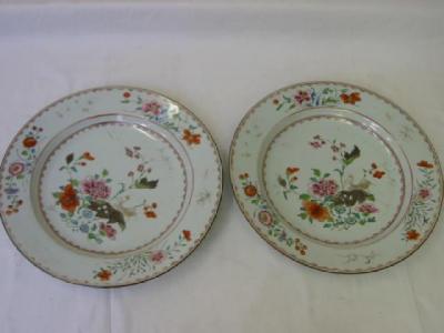 Appraisal: A PAIR OF CHINESE FAMILLE ROSE CHARGERS enamelled and gilded