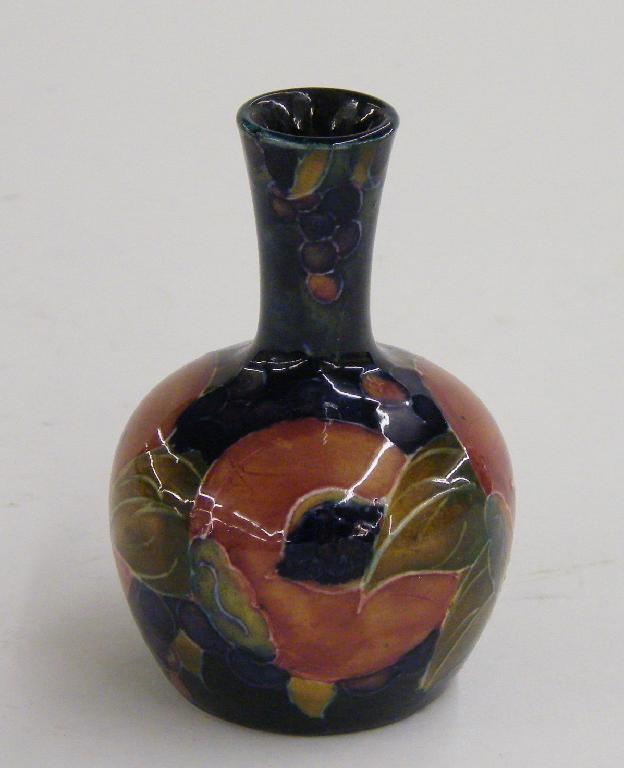 Appraisal: William Moorcroft 'Pomegranate' miniature bottle vase painted W M initials