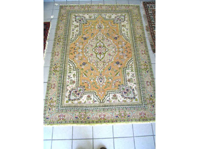 Appraisal: Tabriz Persian Handmade Rug central medallion floral trim soft colors