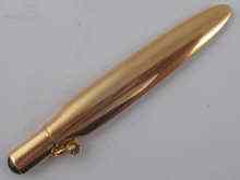 Appraisal: A Russian carat gold pencil holder with cabochon sapphire finial