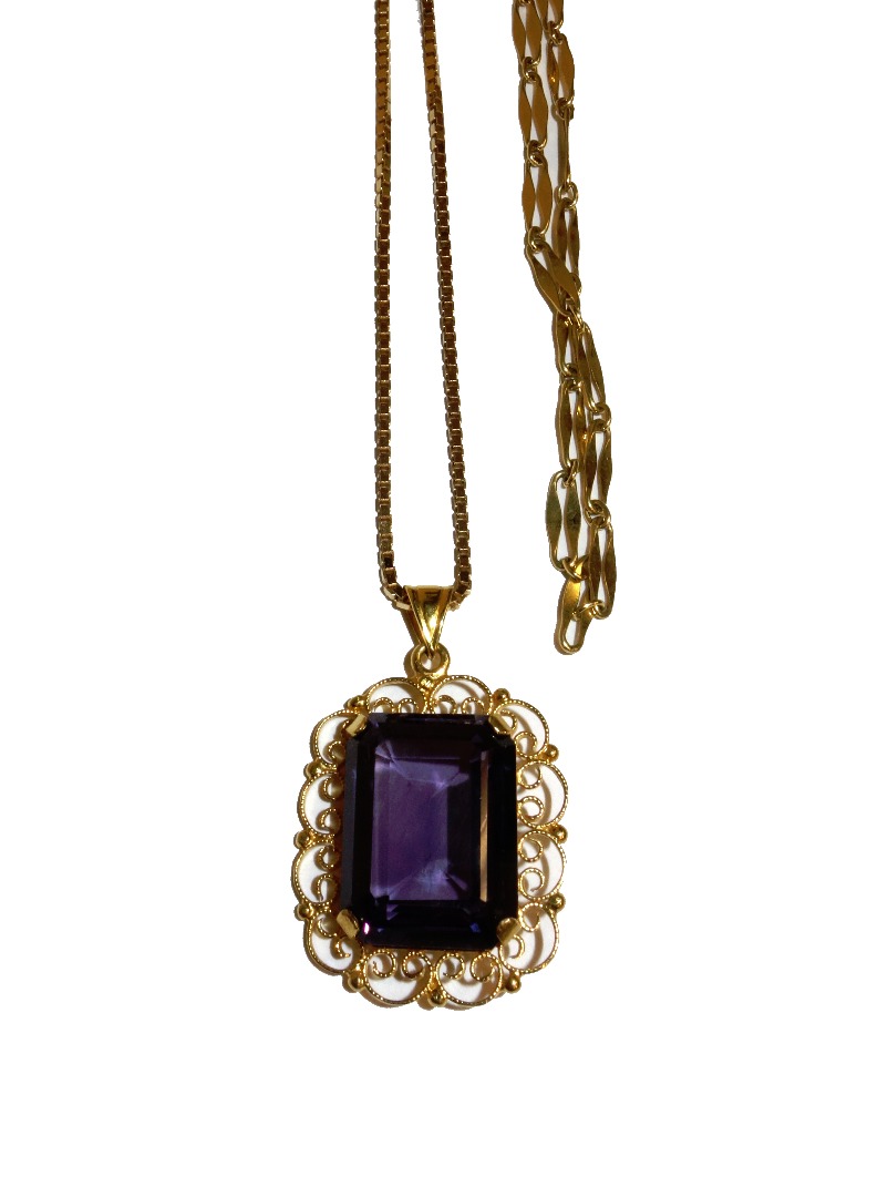 Appraisal: A gold pendant claw set with a cut cornered rectangular