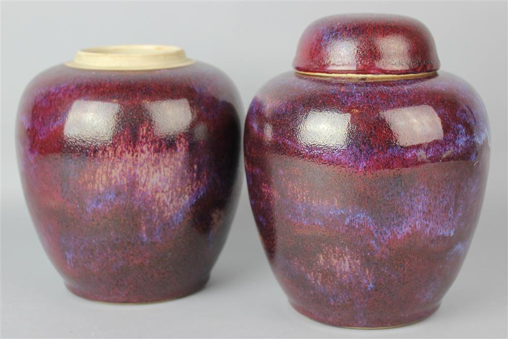 Appraisal: PAIR OF CHINESE FLAMBE-GLAZED OVOID JARS AND A COVER LATE