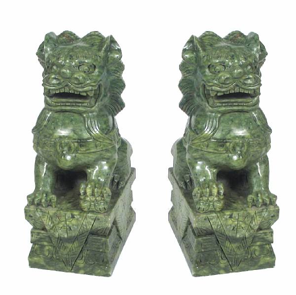 Appraisal: A pair of hardstone seated Fu dogs height in width