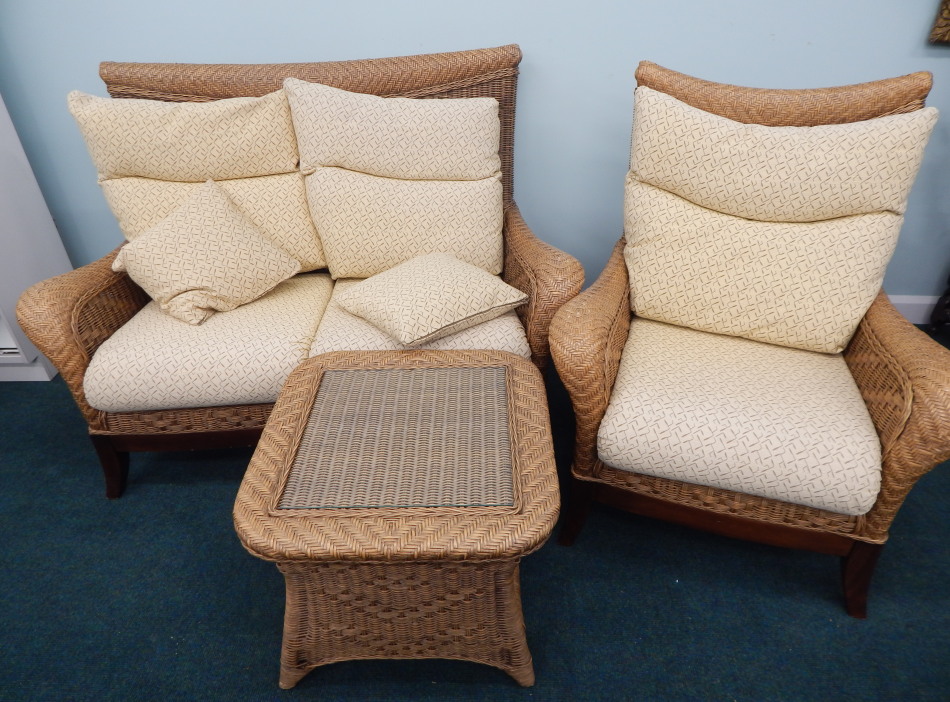 Appraisal: A good quality woven rattan conservatory type suite comprising two