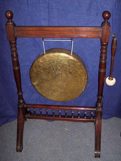 Appraisal: A beaten brass gong in a mahogany frame with galleried