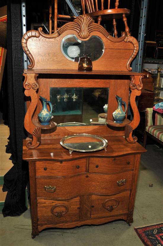 Appraisal: VICTORIAN SIDEBOARD Oak having a mirrored and carved gallery with