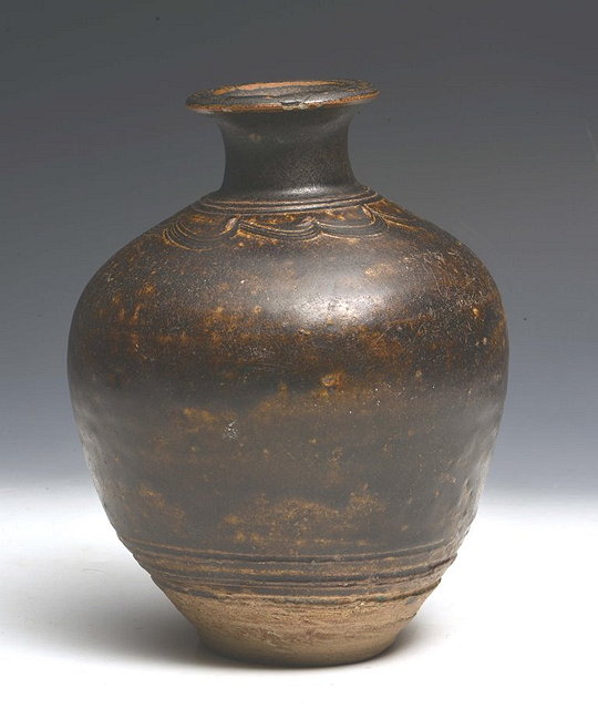 Appraisal: A KHMER ANGKOR PERIOD BROWN GLAZED BOTTLE VASE with combed