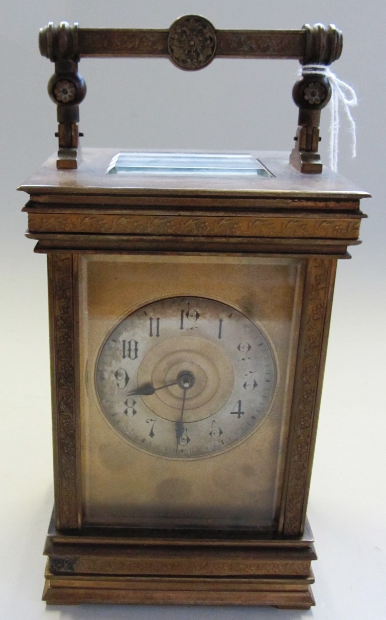 Appraisal: A Victorian brass cased carriage clock with silvered chapter ring