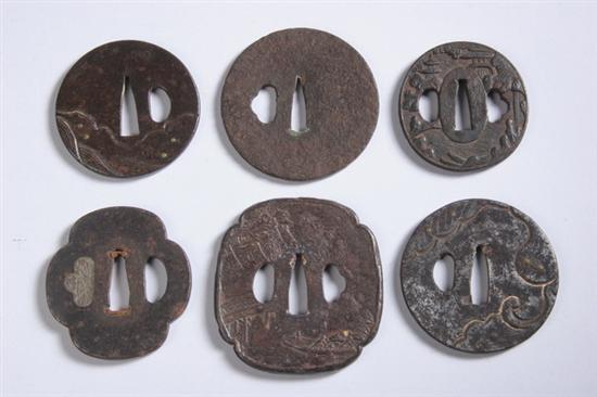 Appraisal: SIX JAPANESE IRON TSUBA Edo Meiji period One quatrefoil with