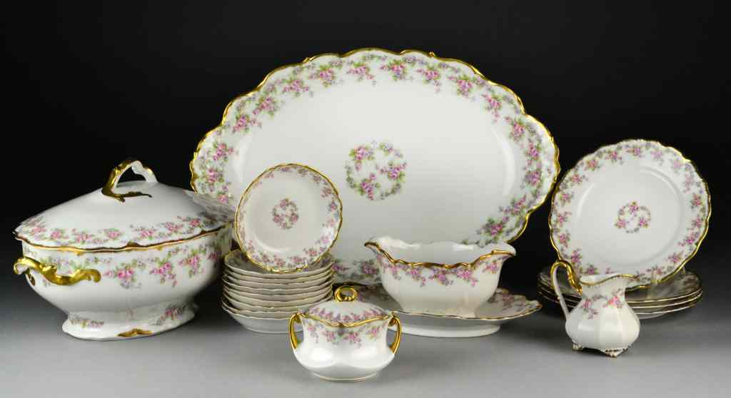 Appraisal: Pcs Limoges Porcelain DinnerwareGilt and floral decoration with scalloped edge