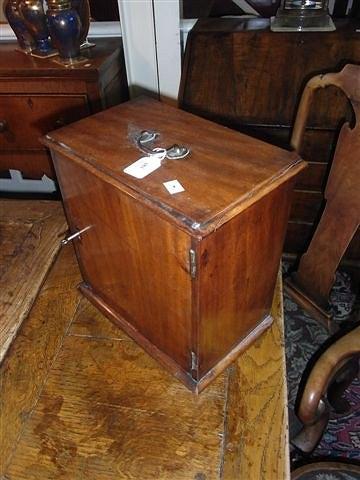 Appraisal: A VICTORIAN MAHOGANY MEDICINE CABINET with various medicine bottles