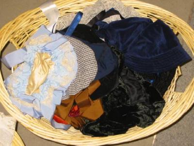 Appraisal: A basket of dolls hats and muffs