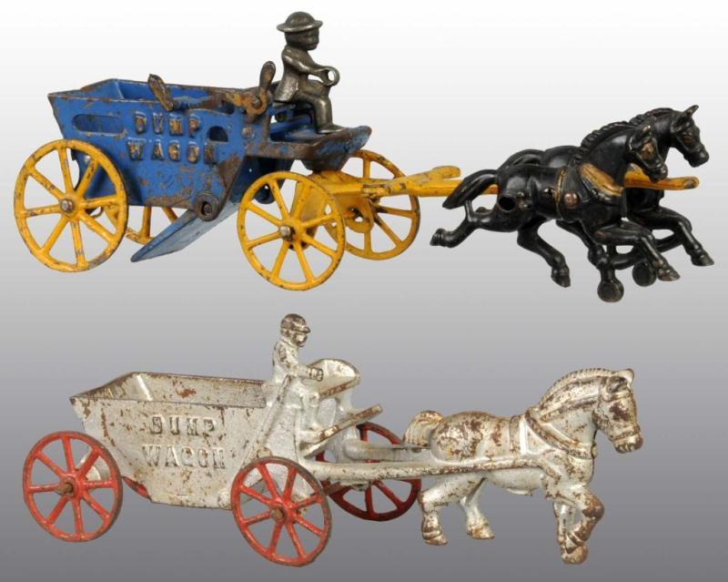 Appraisal: Lot of Cast Iron Horse-Drawn Dump Wagon Toys Condition Good