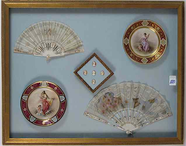 Appraisal: A FRAMED COLLECTION of two French porcelain plates featuring classical