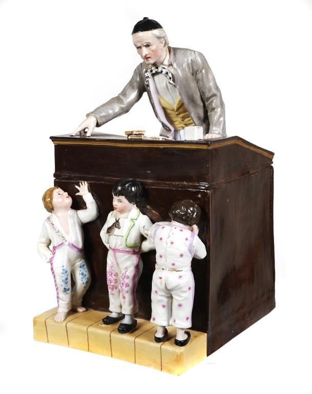 Appraisal: Unusual figural scene of a teacher leaning over his desk