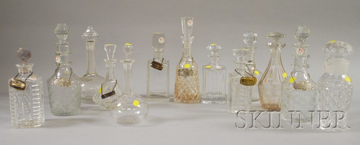 Appraisal: Thirteen Colorless Cut and Pressed Glass Decanters including Waterford and