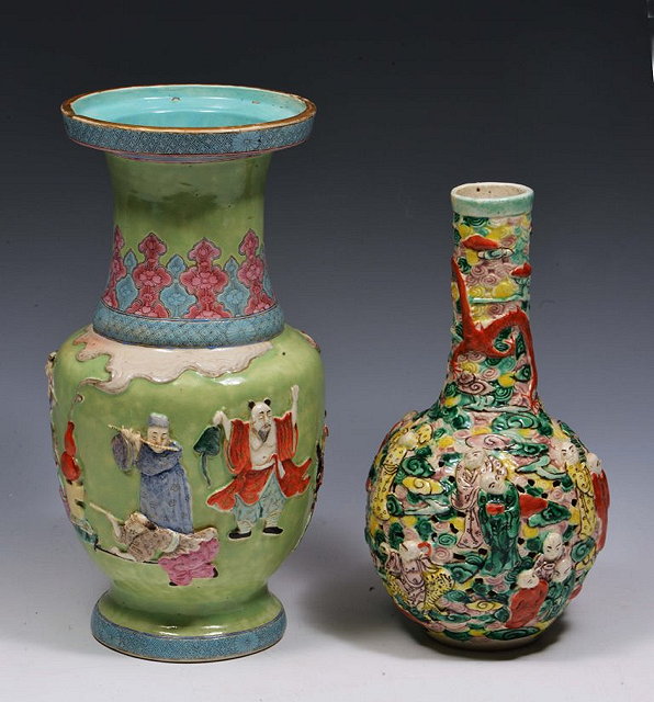 Appraisal: A CHINESE GREEN GROUND BALUSTER VASE with raised scholars and