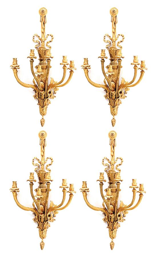 Appraisal: Continental gilt-metal five-light wall sconces draped ribbon surmounting quiver of