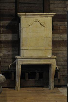 Appraisal: STONE CHIMNEYPIECE WITH PANELLED CHIMNEYBREAST x x in with a