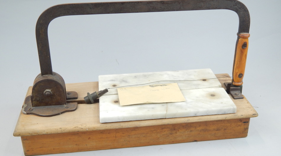 Appraisal: An unusual late th early thC cheese wire cutter with