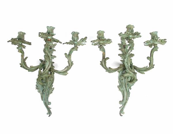 Appraisal: A pair of Louis XV style bronze three light wall