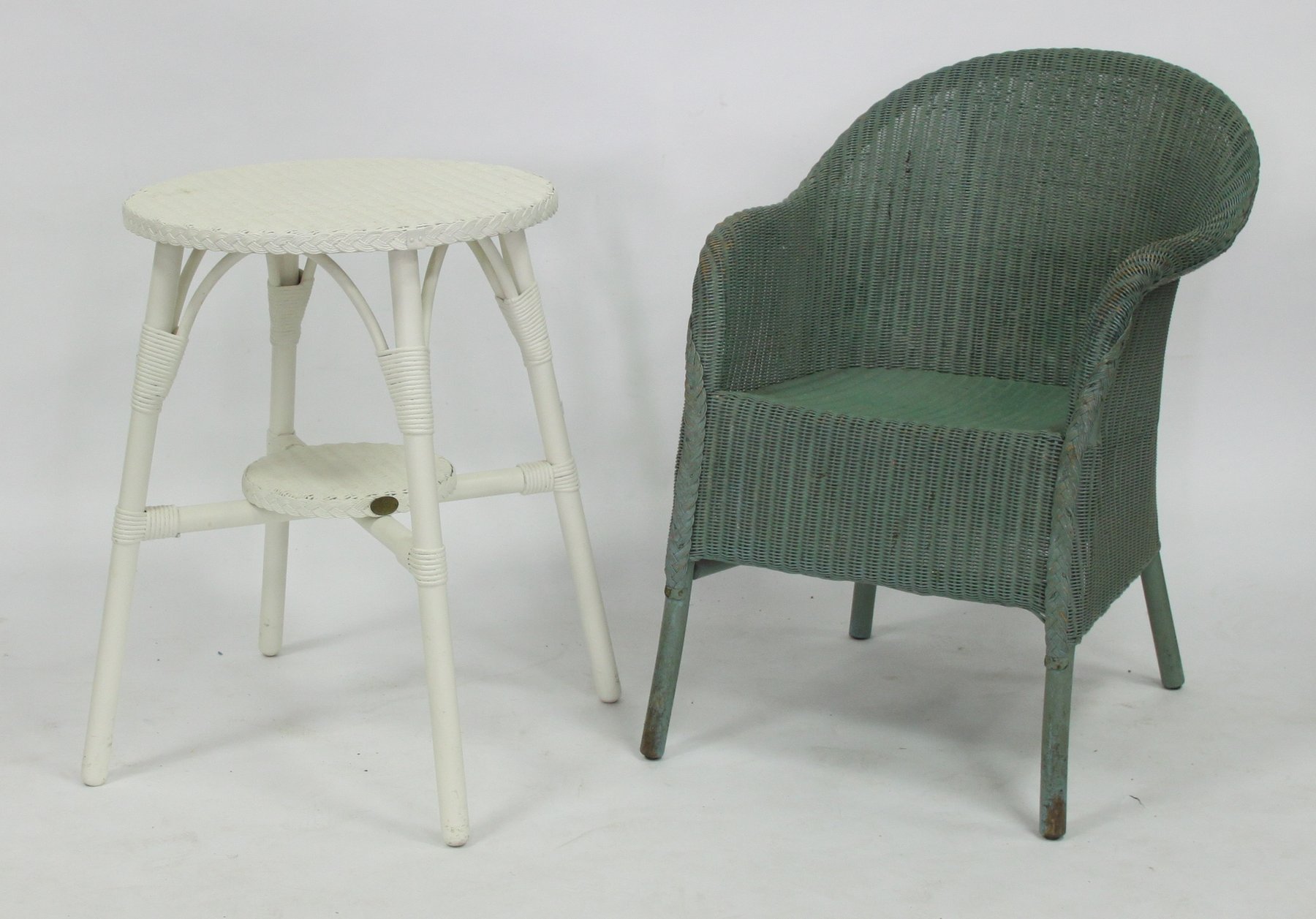 Appraisal: A Lloyd Loom table and chair and a painted circular