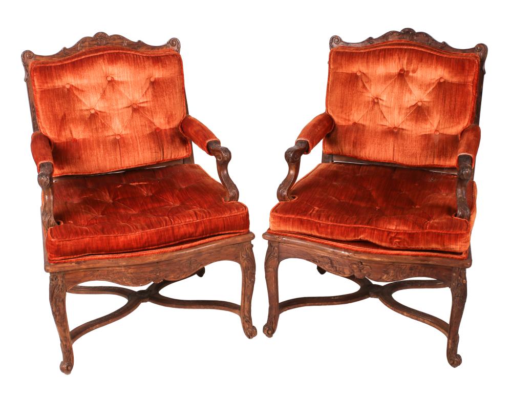 Appraisal: PAIR OF FRENCH PROVINCIAL-STYLE CARVED FAUTEUILS th century loose seat