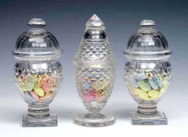 Appraisal: A PAIR OF CUT GLASS SWEET MEAT VASES AND COVERS