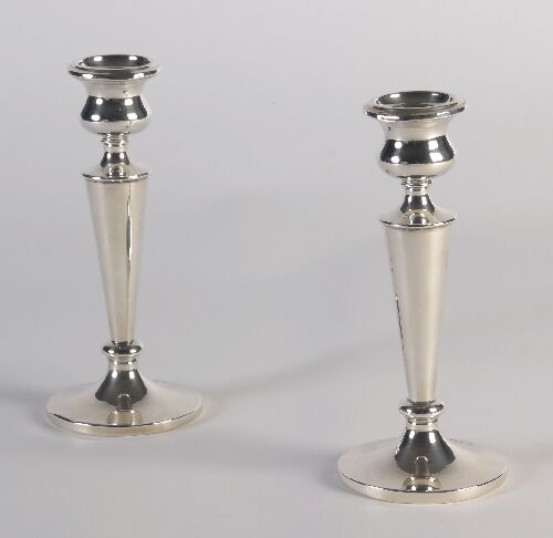 Appraisal: A pair of table candlesticks by Walker Hall Sheffield of