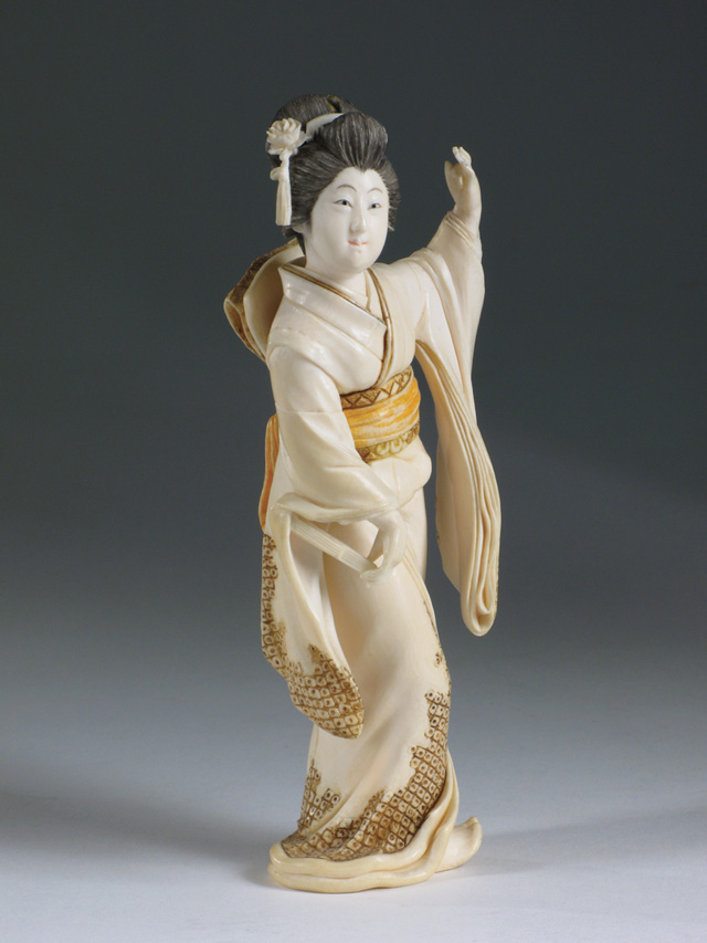 Appraisal: JAPANESE SOLID IVORY HAND CARVED FIGURE OF A GEISHA having