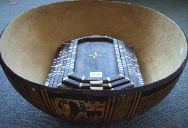 Appraisal: A large carved bowl possibly Polynesian and a graduated set