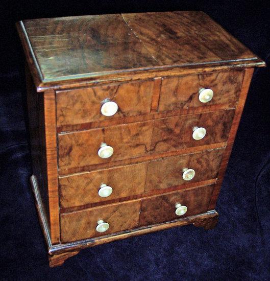 Appraisal: An apprentice's mid th Century mahogany chest of three long