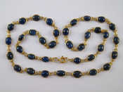 Appraisal: An carat gold cabochon sapphire necklace stones approx x mm