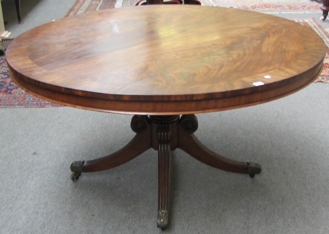 Appraisal: A Regency crossbanded mahogany snap top circular centre table on