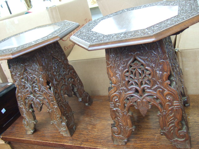 Appraisal: A pair of hardwood occasional tables the octagonal tops with