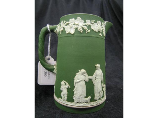 Appraisal: Wedgwood Dark Green Jasperware Milk Pitcher classical maiden cherub scenes